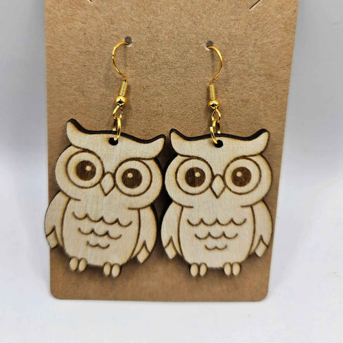 Boucles d’oreilles en bois Chouette Complice sur fond clair