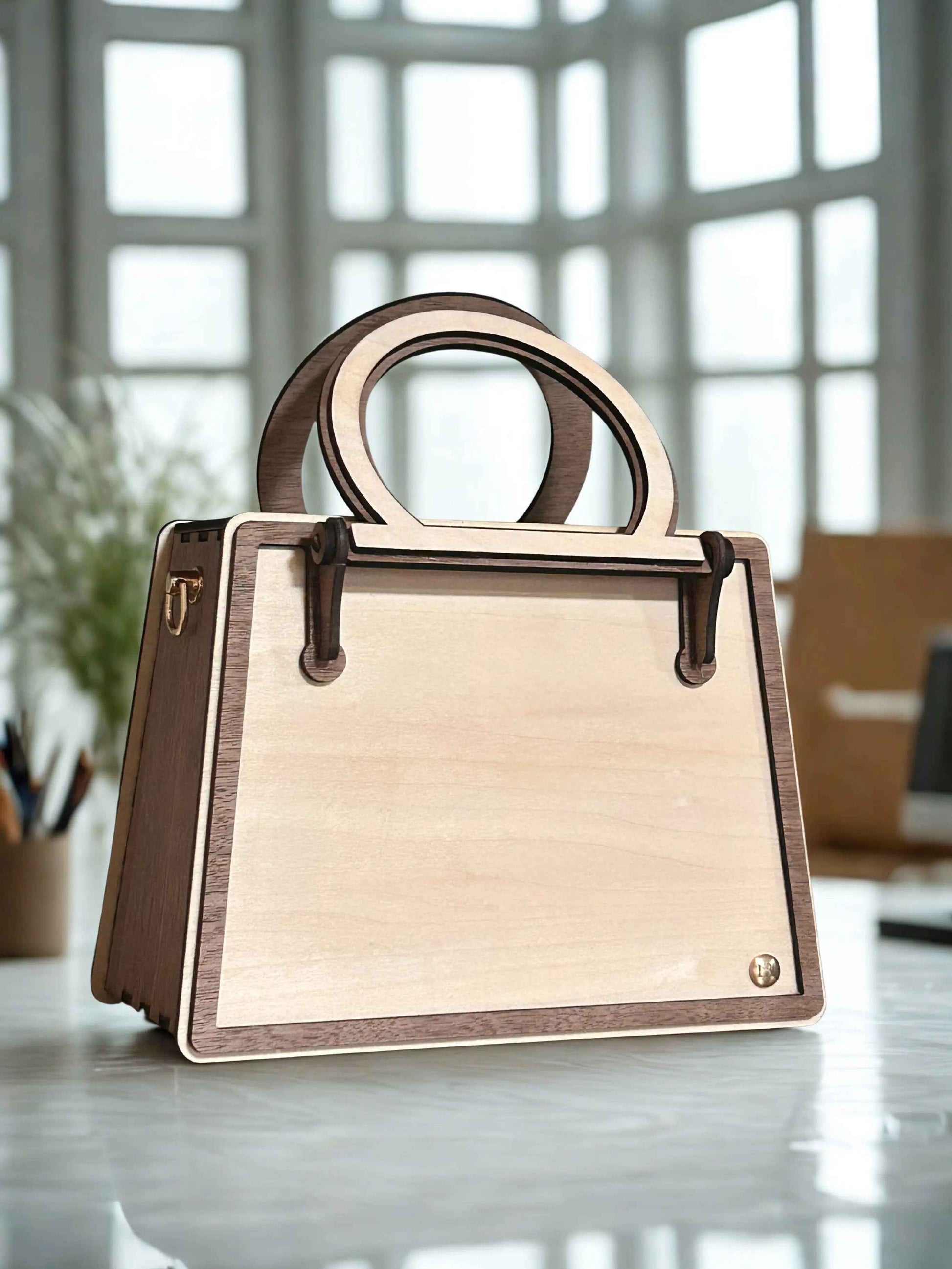 Sac à main glamour de la marque Le Bois Elégant, en cuir élégant avec poignée et détails raffinés.
