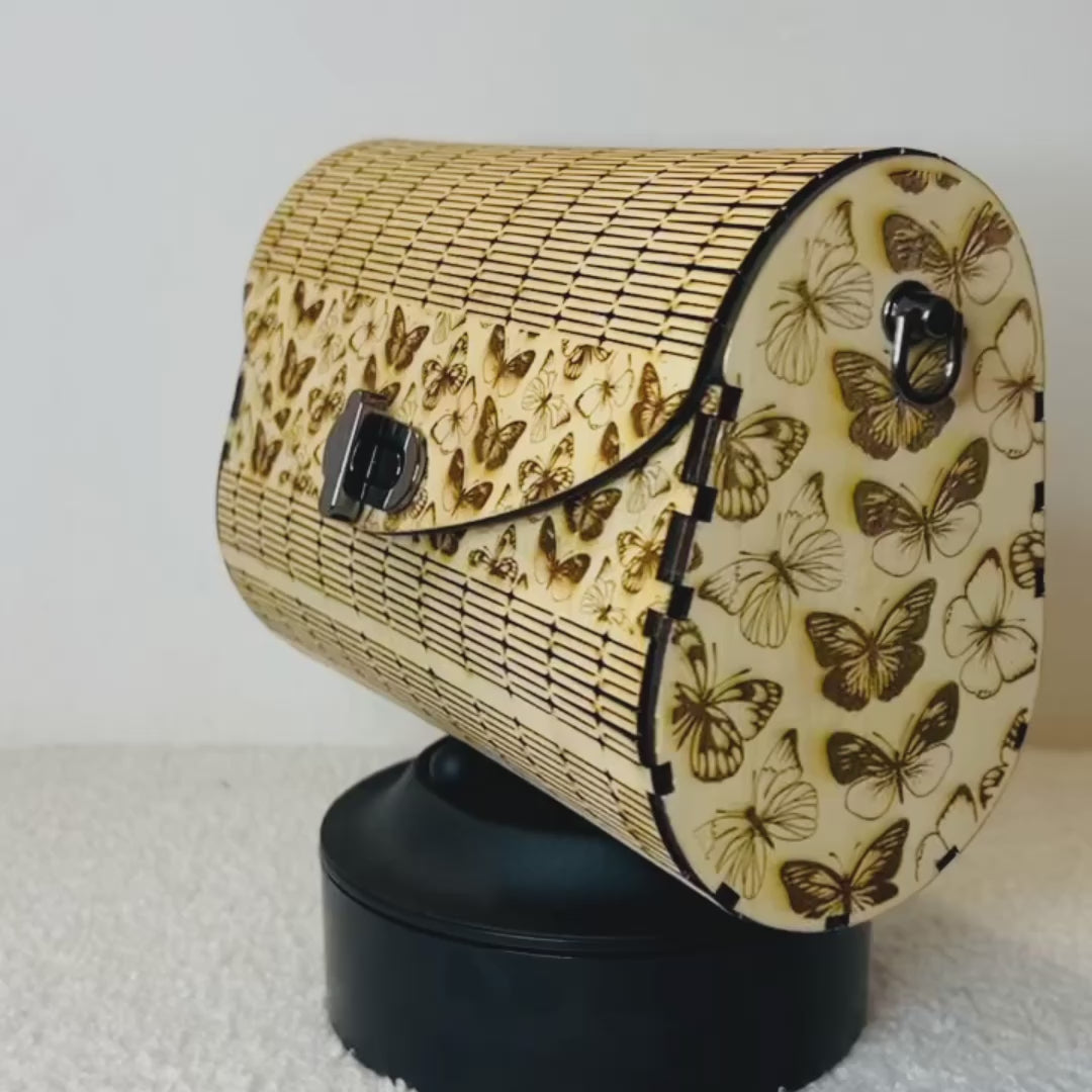 Video du sac en bois le papillon qui tounre sur lui meme